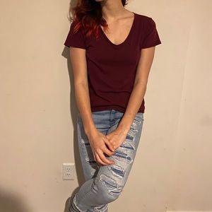 Two red and green v neck t shirts